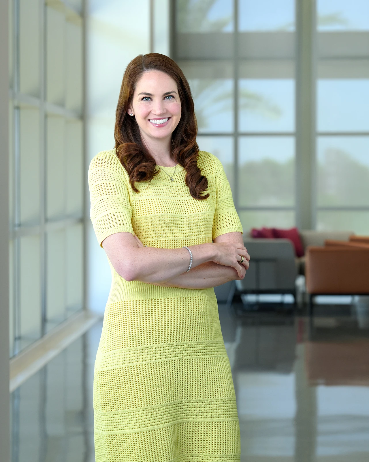 Corporate headshots Phoenix, professional woman photographed in a modern office lobby
